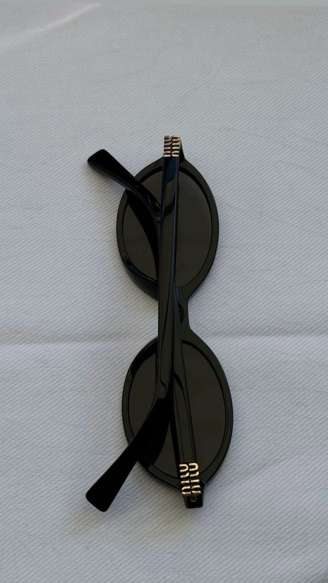 Miu Miu Oval Sunglasses (Black)