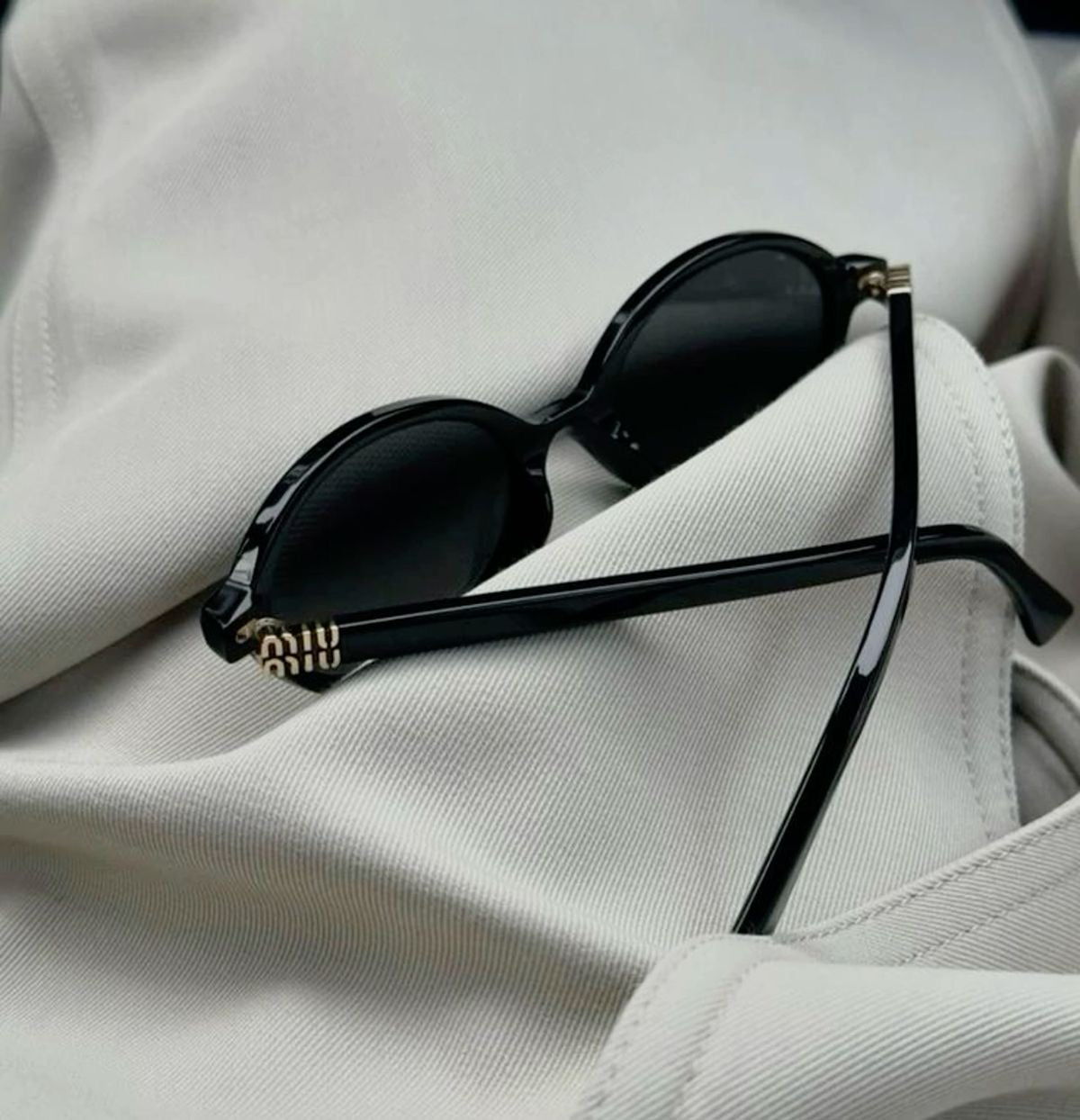 Miu Miu Oval Sunglasses (Black)