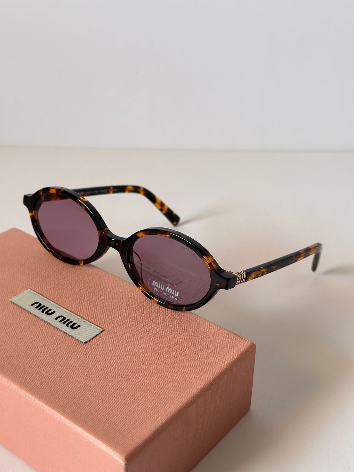 Miu Miu Oval Sunglasses (Brown Cheetah)