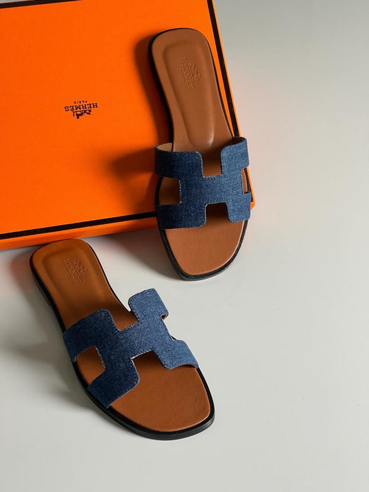 The H slides in denim blue